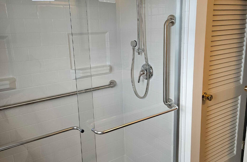 Tub-to-shower conversion with grab bars completed by Home Mobility Pros in Cranston, RI.