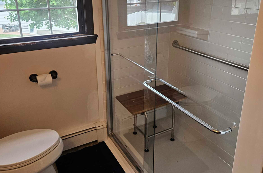 Accessible bathroom design with grab bars and shower seating for safe recovery after surgery