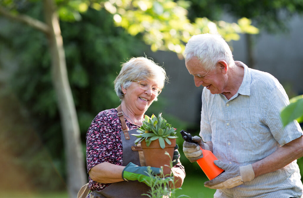 Senior homeowner gardening independently outside an accessible Rhode Island home.