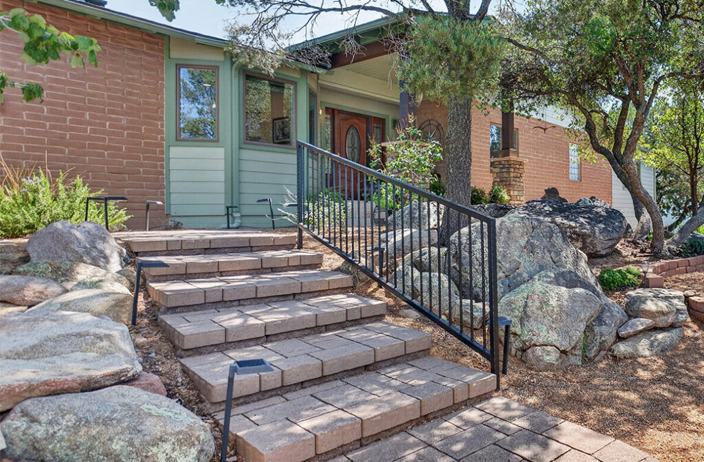 Clear residential walkway and steps with secure handrails for safer home access.